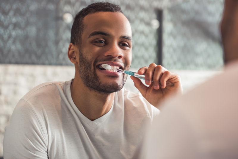 dental-patient-brushing-teeth