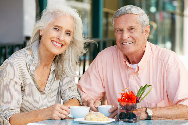 Dental Implant Patients Eating Together With Their False Teeth in Atlanta, GA